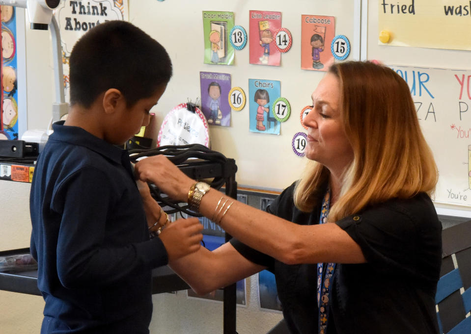 LONG BEACH, CA - AUGUST 28: Ms. Quan gives her first grade students name tags on the first day of school at McKinley Elementary School in Long Beach on Wednesday, August 28, 2019. (Photo by Brittany Murray/MediaNews Group/Long Beach Press-Telegram via Getty Images)