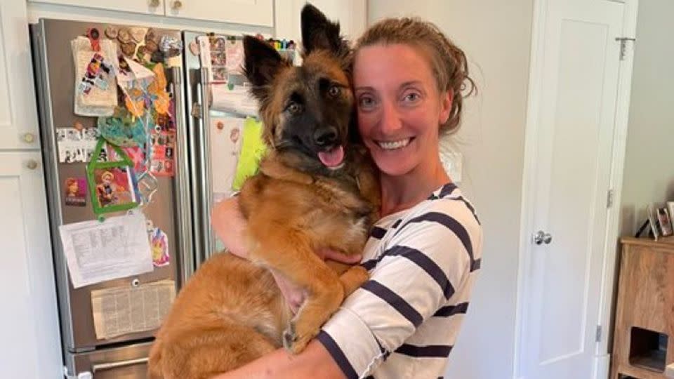Colleen Costello holds her dog, Maple. - Colleen Costello