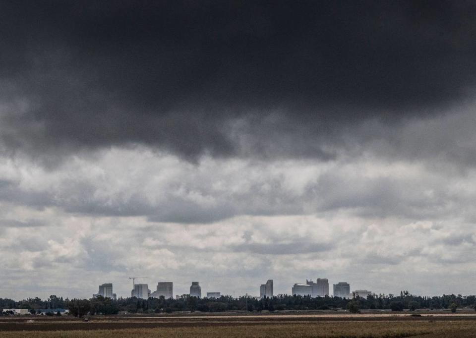 Rain clouds roll past the Sacramento skyline as seen from the Garden Highway near San Juan Road on Monday, Sept. 19, 2022.