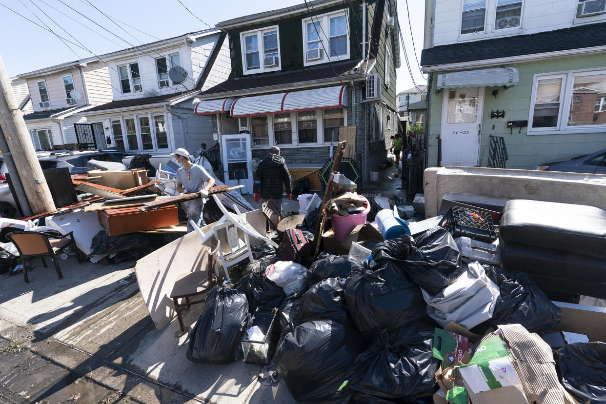 Image: Hurricane Ida flood cleanup. (Mark Lennihan / AP file)