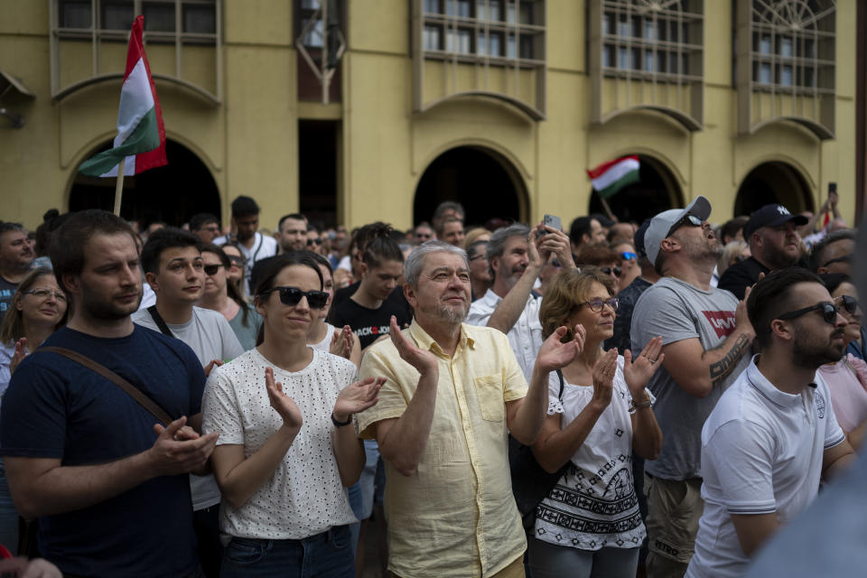 People clap during Péter Magyar's speech at a campaign rally in the rural city of Debrecen, Hungary, on Sunday, May 5, 2024. Magyar, whose TISZA party is running in European Union elections, has managed to mobilize large crowds of supporters on a campaign tour of Hungary's heartland, a rarity for an Orbán opponent. (AP Photo/Denes Erdos)