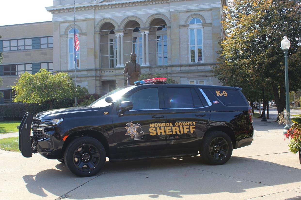 A Monroe County sheriff's vehicle sits outside the justice center.