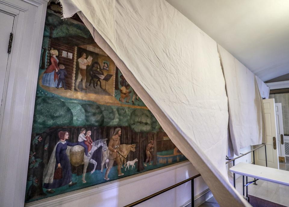 A Courier Journal photographer shows the mural that has been covered by the University of Kentucky's Memorial Hall after students protested and occupied the administration building.  UK President Eli Capilouto agreed to ongoing conversations about the future of the mural that depict images of slavery.
April 3, 2019