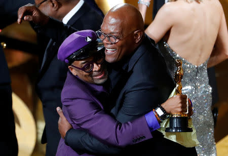 91st Academy Awards - Oscars Show - Hollywood, Los Angeles, California, U.S., February 24, 2019. Spike Lee (L) embraces presenter Samuel L. Jackson as he wins the "Adapted Screenplay" award for "BlacKkKlansman." REUTERS/Mike Blake