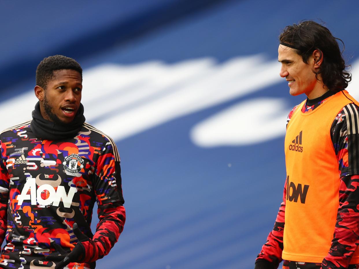 <p>Fred (left) and Edinson Cavani warm up for Man United</p> (Manchester United via Getty Images)