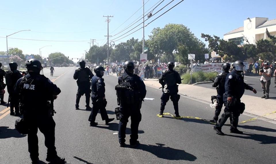 A video capture shows police mobilizing to disperse protesters after Modesto Police declared the gathering an “unlawful assembly” after a small fight at Planned Parenthood office in Modesto, Calif., on Saturday, August 27, 2022. People gathered to protest the planned Straight Pride event.