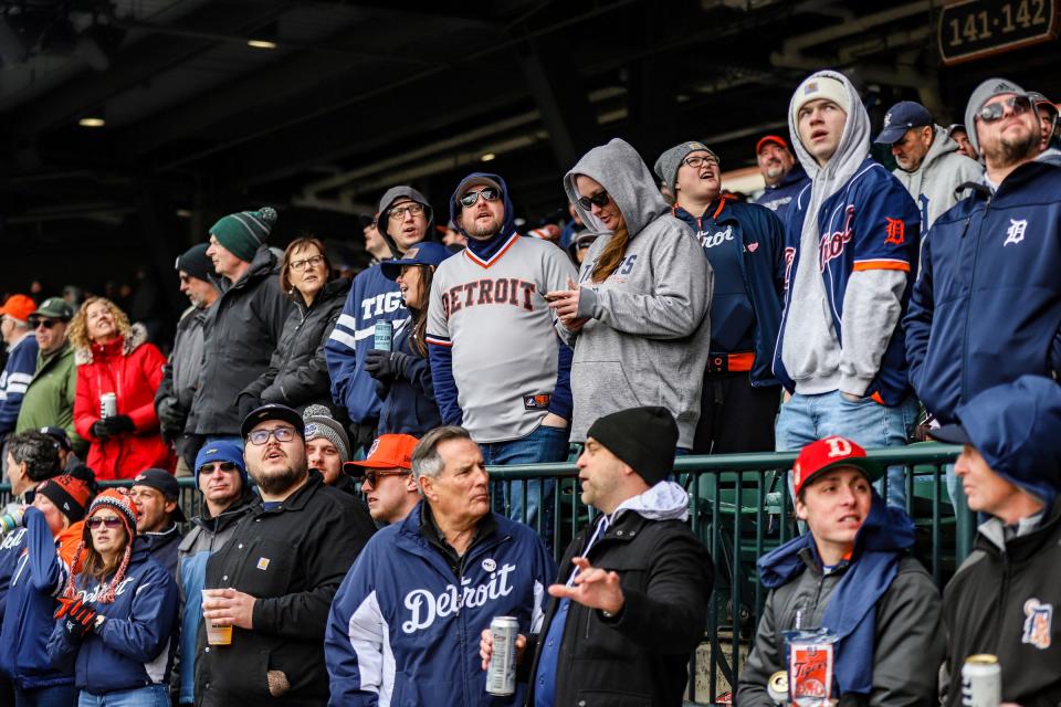 Fans sing “Take Me Out to the Ballgame” during the seventh-inning stretch during the Detroit Tigers Opening Day game at Comerica Park in Detroit on Friday, April 5, 2024.