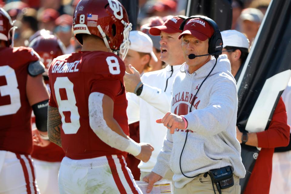 Oklahoma coach Brent Venables fist bumps Oklahoma Sooners quarterback Dillon Gabriel (8) during a college football game between the University of Oklahoma Sooners (OU) and the TCU Horned Frogs at Gaylord Family-Oklahoma Memorial Stadium in Norman, Okla., Friday, Nov. 24, 2023. Oklahoma won 69-45.