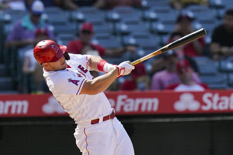 Los Angeles Angels' Mike Trout follows through after hitting a home run during the eighth inning of a baseball game against the Houston Astros, Sunday, Sept. 4, 2022, in Anaheim, Calif. (AP Photo/Jae C. Hong)
