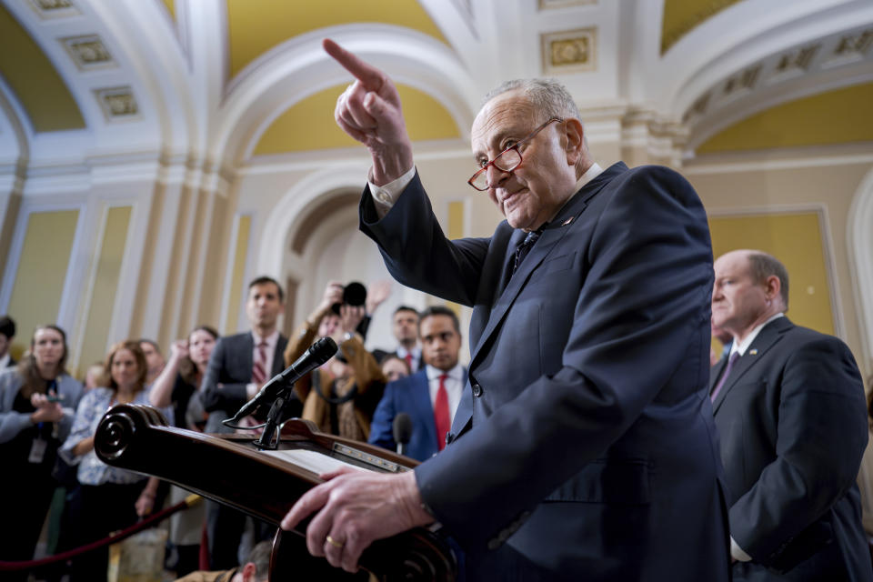 Senate Majority Leader Chuck Schumer, D-N.Y., answers questions on the border security talks as he meets reporters following a Democratic caucus meeting, at the Capitol in Washington, Wednesday, Jan. 31, 2024. (AP Photo/J. Scott Applewhite)