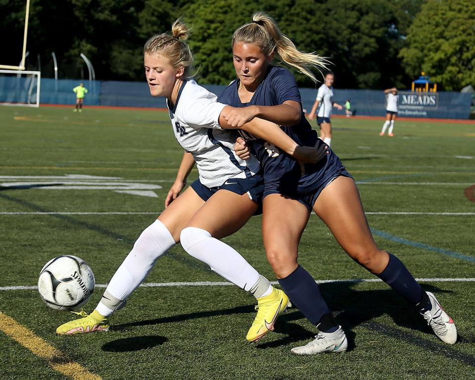Plymouth North's Abby Chambers battles Hanover's Olivia Henry for the ball in the corner during first half action of their game against Hanover at Hanover High on Thursday, Sept. 15, 2022.