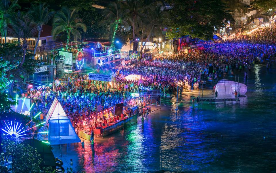 The famous outdoor Full Moon Party at the public Haad Rin Beach on the Island Koh Phangan in South Thailand - Getty/E+