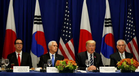 From left, U.S. Treasury Secretary Steve Mnuchin, Vice President Mike Pence, U.S. President Donald Trump and Secretary of State Rex Tillerson, meet with South Korean president Moon Jae-in and Japanese Prime Minister Shinzo Abe during the U.N. General Assembly in New York, U.S., September 21, 2017. REUTERS/Kevin Lamarque