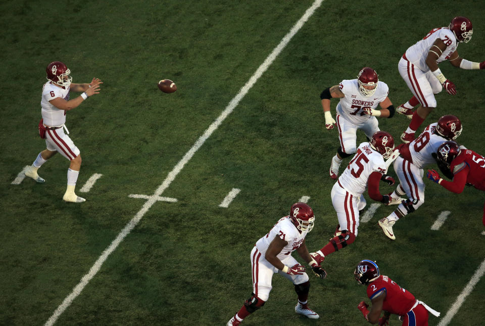 Oklahoma quarterback Baker Mayfield (6) during the second half of an NCAA college football game against Kansas in Lawrence, Kan., Saturday, Nov. 18, 2017. (AP Photo/Orlin Wagner)