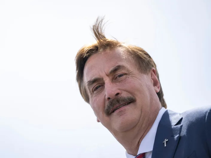An image of MyPillow CEO Mike Lindell, smiling at the photographer