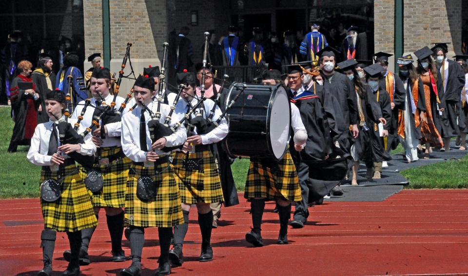 The Scott bagpipers escorted the graduating seniors into Papp football stadium.