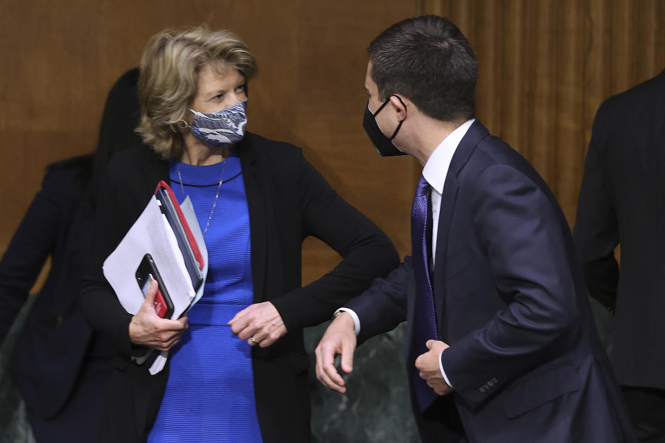 Sen. Lisa Murkowski, R-Alaska, greets Transportation Secretary Pete Buttigieg before a Senate Appropriations Committee hearing on Capitol Hill, Tuesday, April 20, 2021 in Washington. (Chip Somodevilla/Pool via AP)