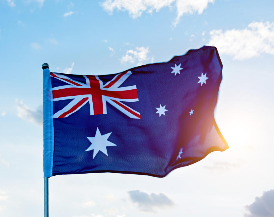 Waving Australia flag in the air. Source: Getty Images