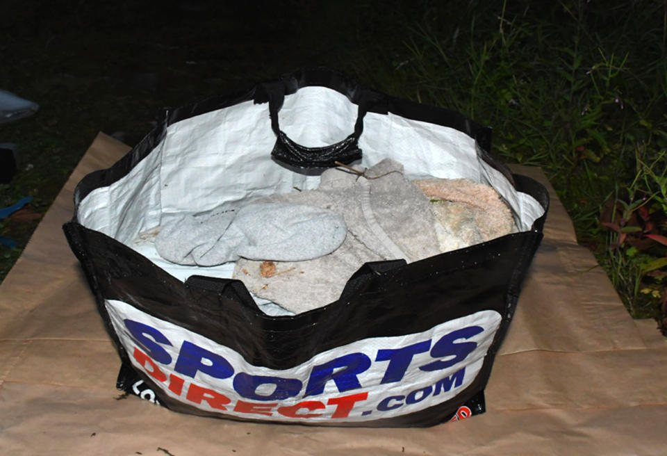 The bloodstained contents of one of two carrier bags recovered from a New Tredegar riverbank (Gwent Police/PA)