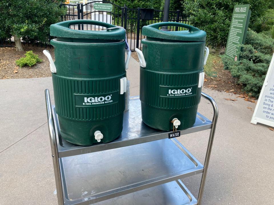 Coolers of free ice water near the pool at Dollywood's DreamMore Resort.