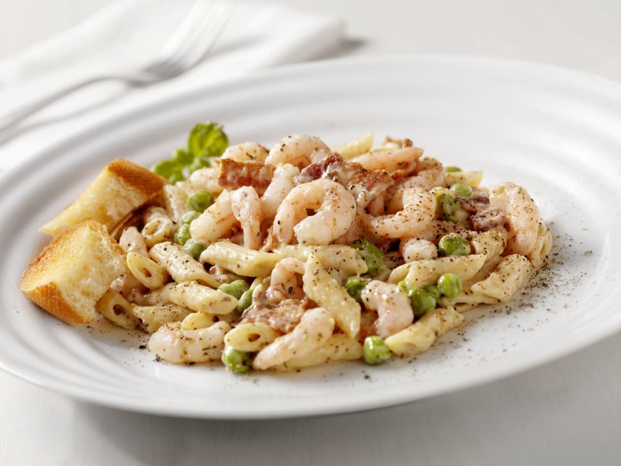 Shrimp, Bacon and Green Peas in a Cream Sauce on Penne Pasta with Toasted Garlic Bread -Photographed on Hasselblad H3D2-39mb Camera