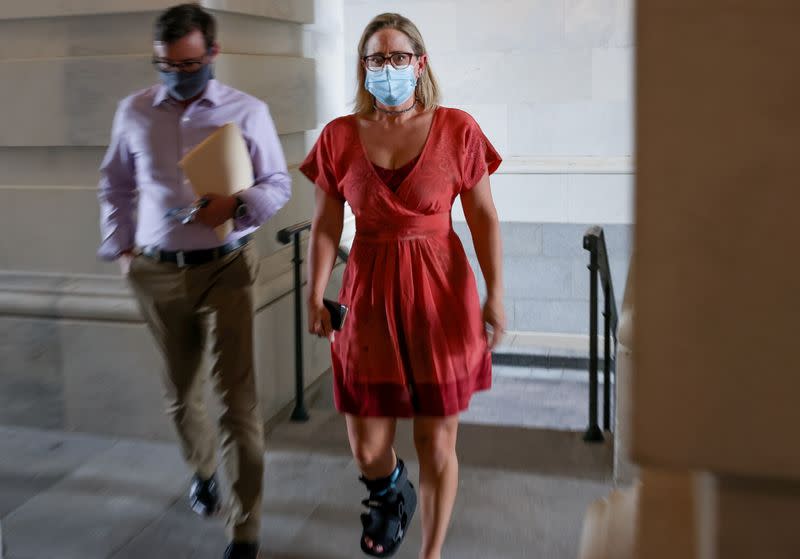 Senator Kyrsten Sinema arrives on Capitol Hill in Washington