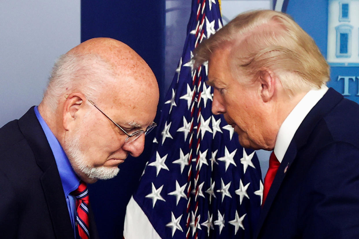 U.S. President Donald Trump gives the podium to Centers for Disease Control (CDC) Director Robert Redfield to address the daily coronavirus disease (COVID-19) outbreak task force briefing at the White House in Washington, U.S. April 22, 2020.  REUTERS/Jonathan Ernst