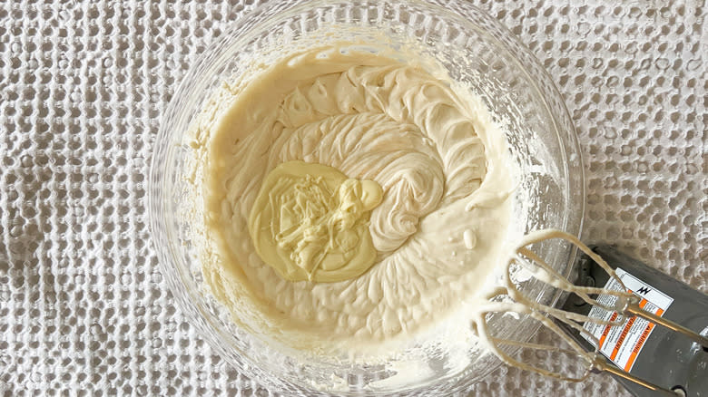 Bright and sunny lemon lavender cake batter with melted white chocolate in mixing bowl