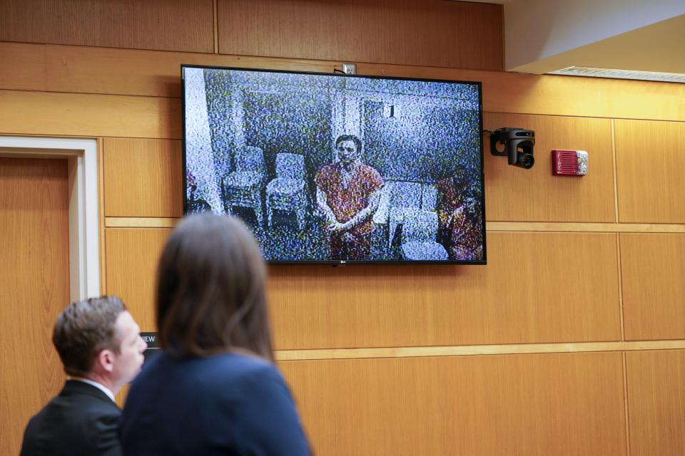 Tomasz Kosowski, a local plastic surgeon arrested in the death of missing Largo attorney, Steve Cozzi, makes his first appearance in court in Clearwater, Fla., on Monday, March 27, 2023, remotely from the Pinellas County Jail. (Martha Asencio-Rhine/Tampa Bay Times via AP)