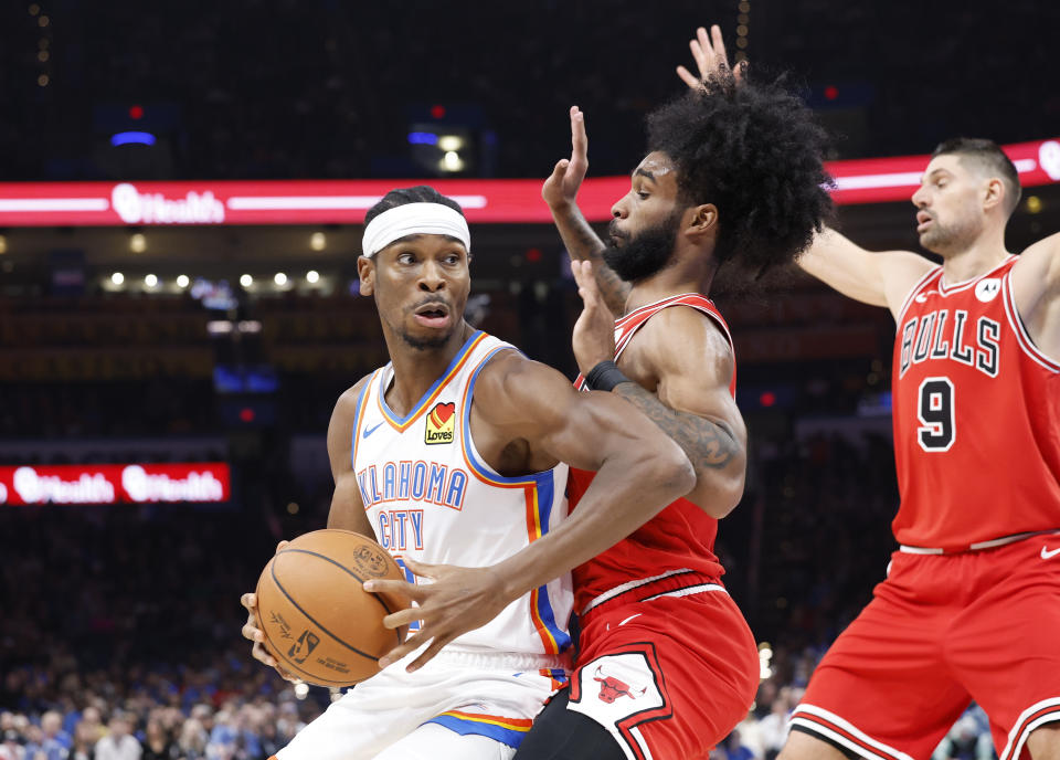 Nov 22, 2023; Oklahoma City, Oklahoma, USA; Oklahoma City Thunder guard Shai Gilgeous-Alexander (2) is defended by Chicago Bulls guard <a class="link " href="https://sports.yahoo.com/nba/players/6169" data-i13n="sec:content-canvas;subsec:anchor_text;elm:context_link" data-ylk="slk:Coby White;sec:content-canvas;subsec:anchor_text;elm:context_link;itc:0">Coby White</a> (0) on a drive to the basket during the second quarter at Paycom Center. Mandatory Credit: Alonzo Adams-USA TODAY Sports