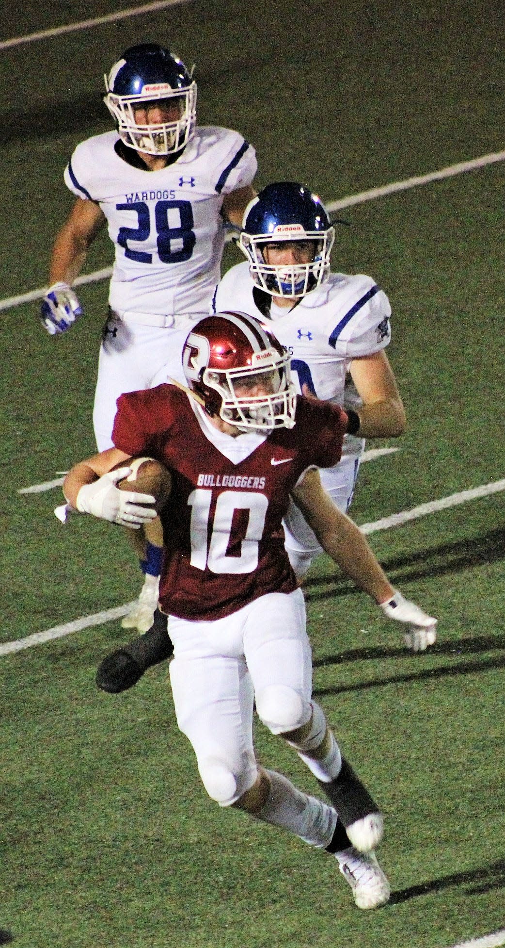 Colby Miller, No. 10, picks up some yards for Dewey High during grid action earlier last season.