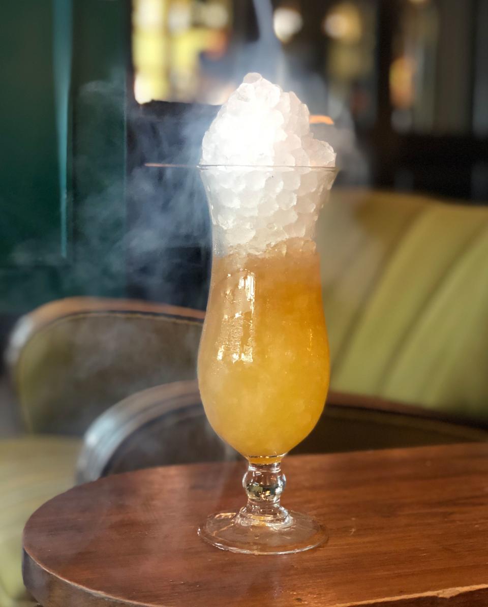 Ace Hotel New Orleans’s King Tut, garnished with flaming palo santo bark
