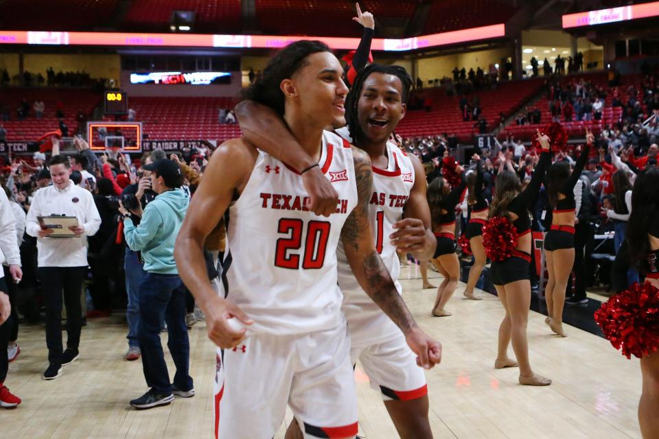 Jan 30, 2023; Lubbock, Texas, USA;  Texas Tech Red Raiders guard Jaylon Tyson (20) and guard Lamar Washington (1) leave the court after the overtime win over the Iowa State Cyclones at United Supermarkets Arena. Mandatory Credit: Michael C. Johnson-USA TODAY Sports ORG XMIT: IMAGN-512080 ORIG FILE ID:  20230130_tdc_aj7_0433.JPG