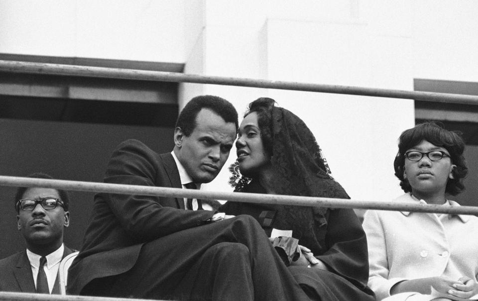 FILE - Singer and Civil Rights activist Harry Belefonte listens to Coretta Scott King, widow of the slain civil rights leader, in Memphis, Tennessee on April 8, 1968. Belafonte died Tuesday of congestive heart failure at his New York home. He was 96. (AP Photo/Gene Herrick, File)