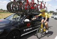 Race leader and yellow jersey holder Trek Factory rider Fabian Cancellara of Switzerland takes energy gel from his team car during the 159,5 km (99 miles) third stage of the 102nd Tour de France cycling race from Anvers to Huy, Belgium, July 6, 2015. REUTERS/Eric Gaillard