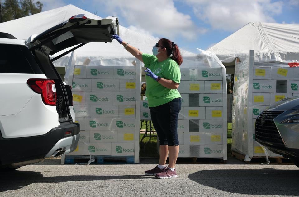 <span class="caption">Demand for food aid has soared during the pandemic.</span> <span class="attribution"><span class="source">Joe Raedle/Getty Images</span></span>