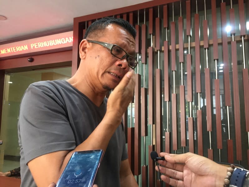 Epi Samsul Komar, 52, a relative of a victim of crashed Lion Air flight JT610 reacts as he speaks to reporters in Jakarta