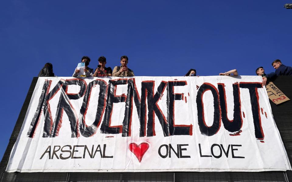 'Kroenke Out' banners are frequently seen at the Emirates - PA