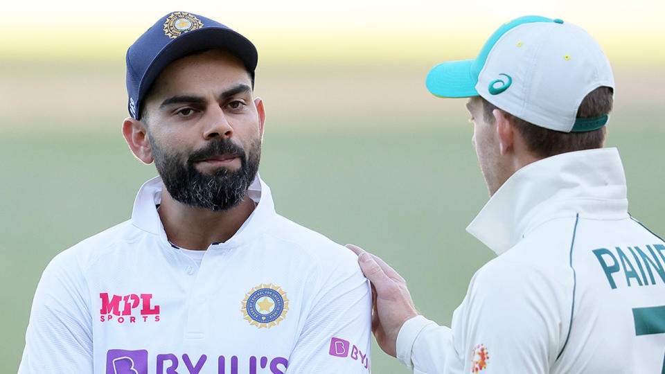 Pictured here, India captain Virat Kohli with Aussie counterpart Tim Paine.