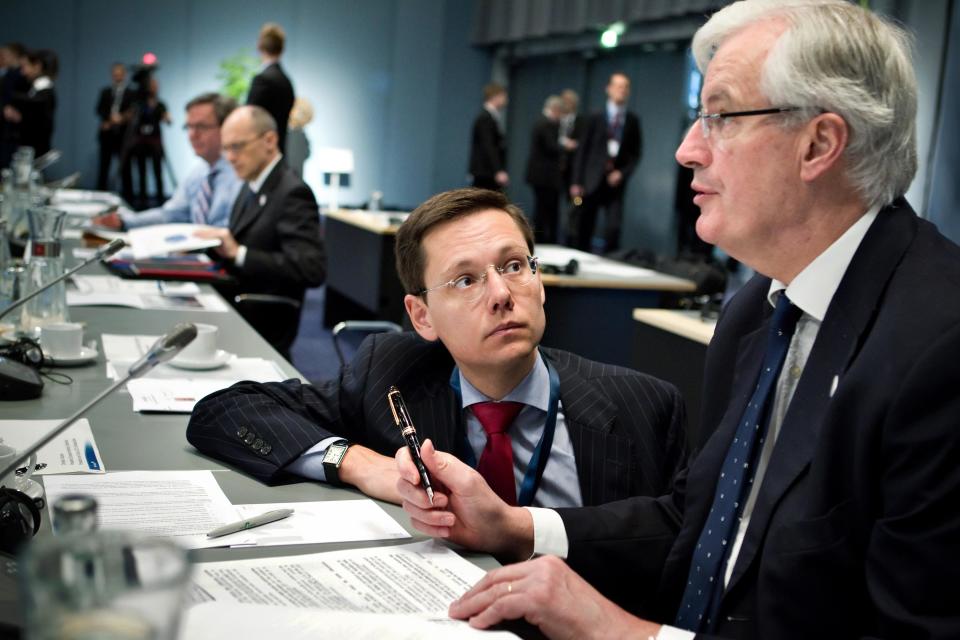 European Commisioner Michel Barnier of France, right, prepares for the second day of a eurozone finance ministers meeting, in Copenhagen, Denmark Saturday March 31, 2012. Several European finance chiefs said Friday the 17 countries that use the euro are unlikely to boost their financial backstop to the Euros1 trillion ($1.3 trillion) demanded by many of their international partners. (AP Photo/Lars Krabbe/Polfoto) DENMARK OUT