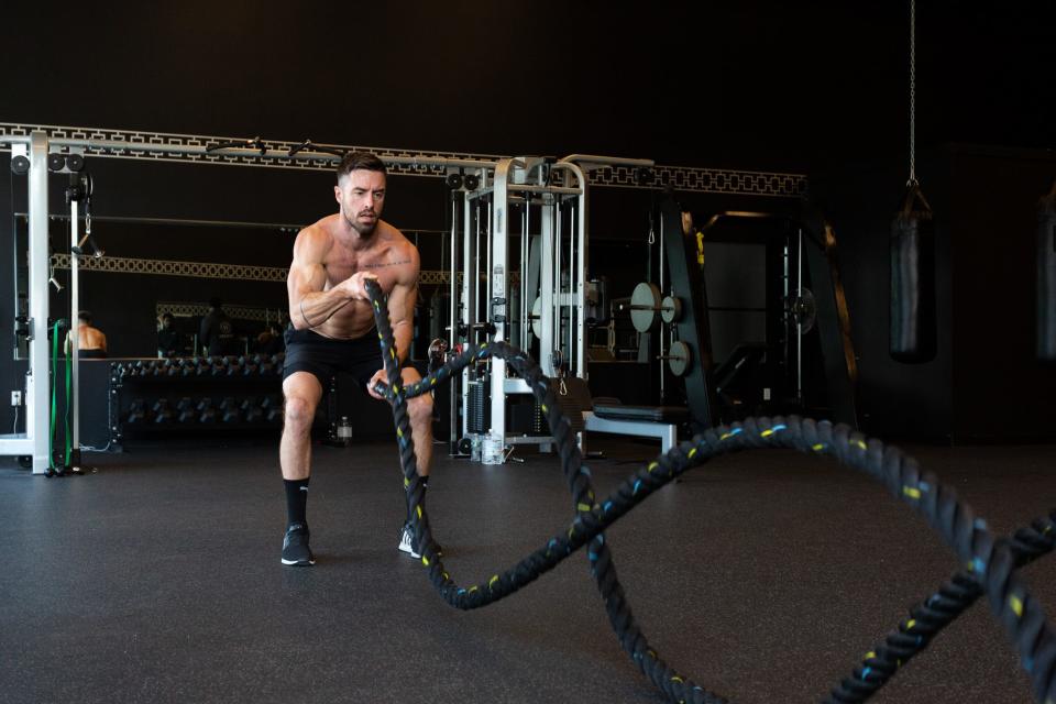 Ian Anderson, owner of Ian Anderson Training, during a workout using battle ropes.