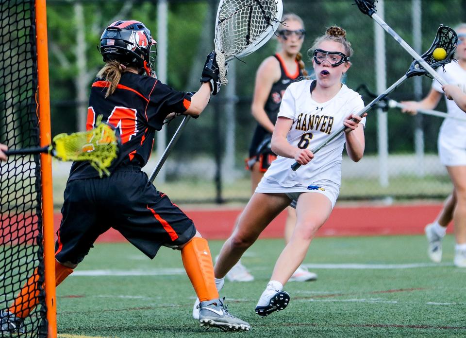 Hanover's Ayla McDermod approaches the net during a game in the Division 3 state tournament against Middleboro on Tuesday, June 7, 2022.