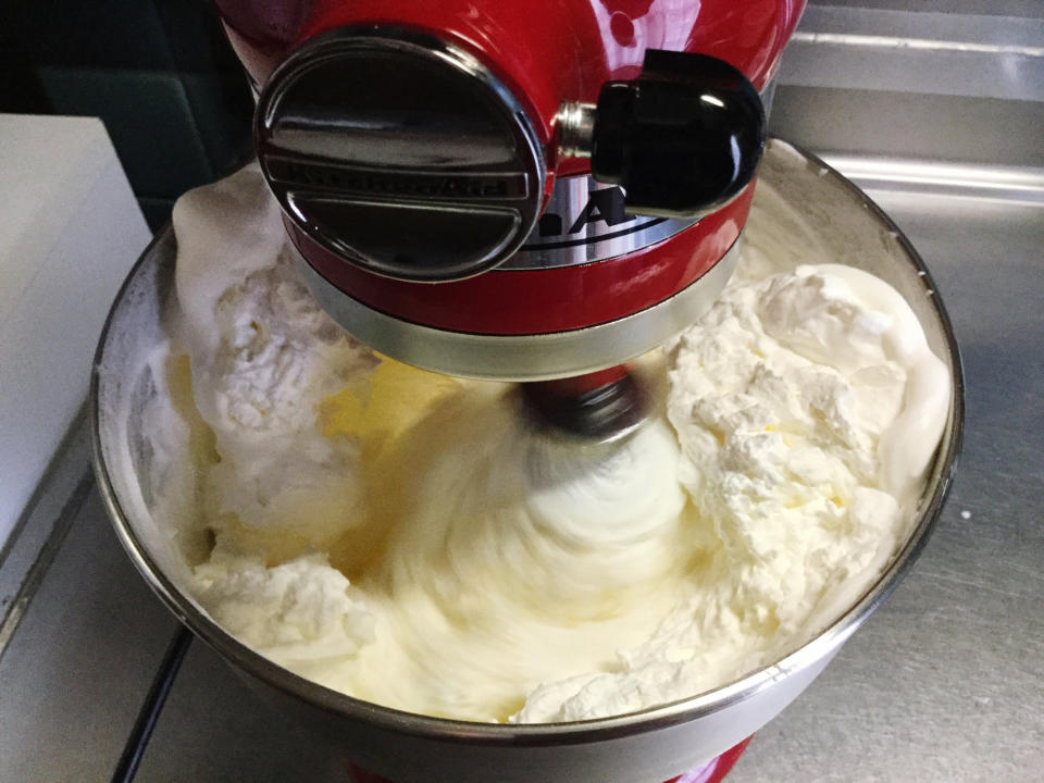 Whipping butter in an electric mixer.