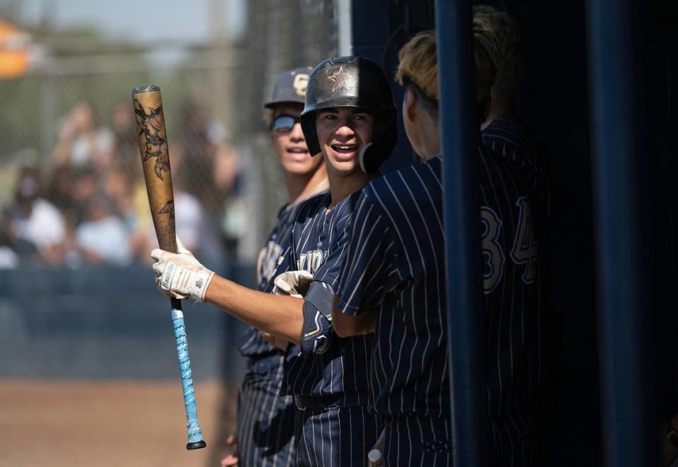 Central Catholic’s players Adrian Garcia, right, AJ Milligi, middle, and Joseph Salacup in the dugout during the Northern California Regional Division III championship game with Oakmont at Central Catholic High School in Modesto, Calif., Saturday, June 3, 2023.