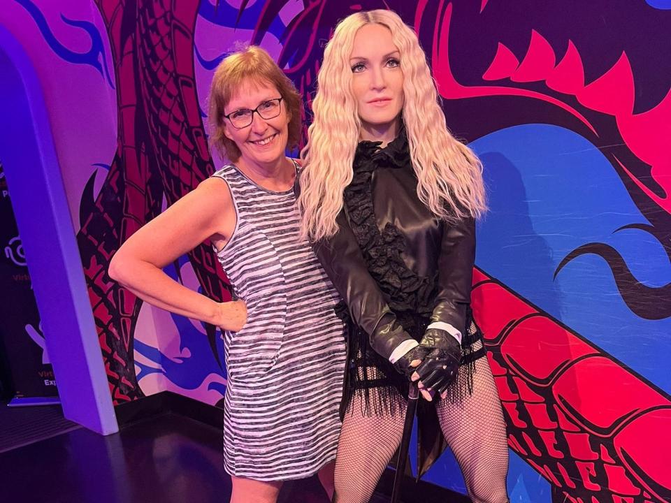 Writer's mother poses with a wax figure of Madonna