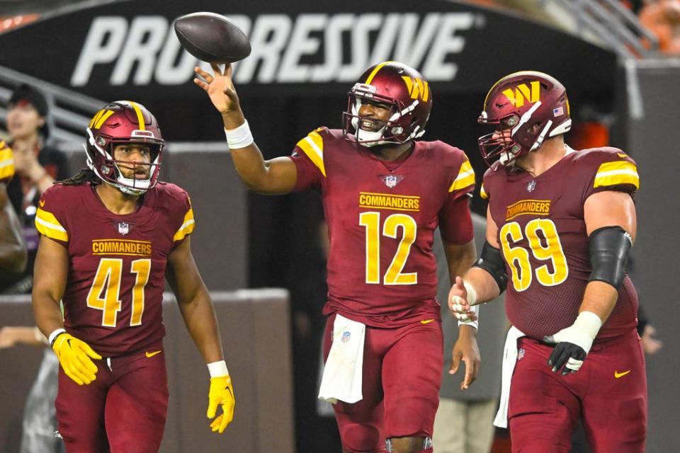 Washington Commanders quarterback Jacoby Brissett celebrates after scoring against the Cleveland Browns in a preseason game Friday in Cleveland.