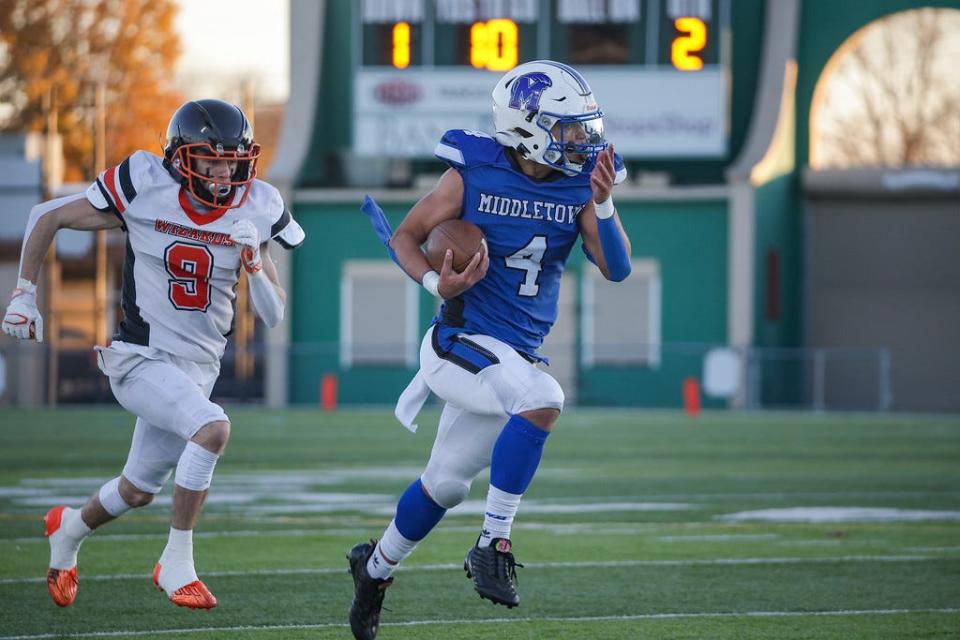 Middletown's Trent Ames (4) returns an interception against West Warwick in the Division III Super Bowl on Saturday at Cranston Stadium. 11/18/23