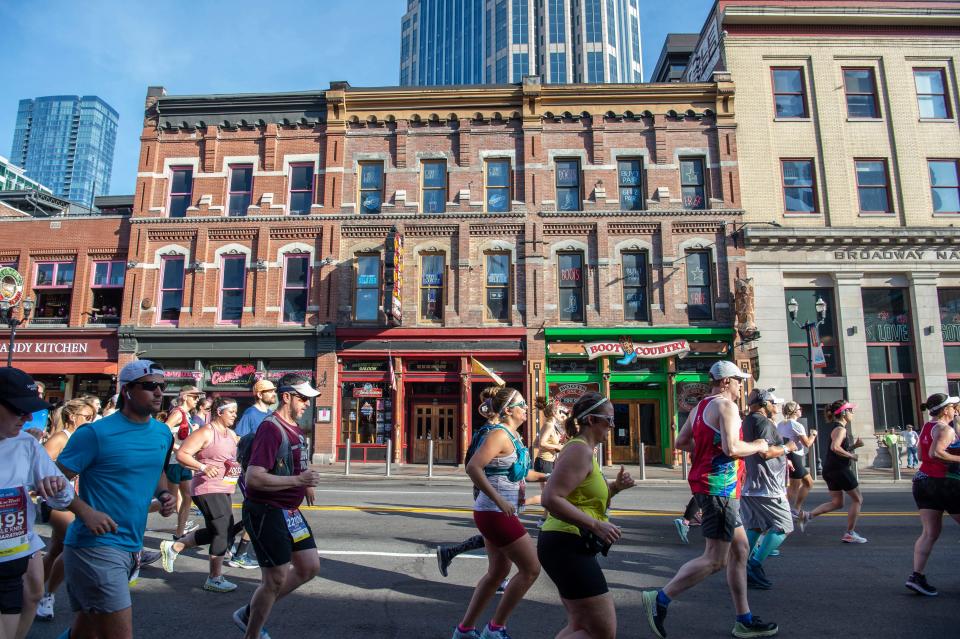 Runners make their way down broadway during the St. Jude Rock 'n' Roll Marathon and Half Marathon Saturday, April 23, 2022 in Nashville, Tenn. 