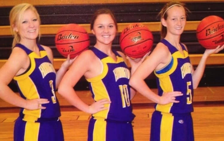 Three Farmington (Ill.) High seniors appear to flash "the shocker" in this basketball photo -- Twitter