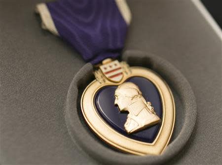 World War II veteran Richard "Dick" Faulkner's Purple Heart medal is shown after it was presented to him in Auburn, New York March 8, 2014. REUTERS/Mike Bradley